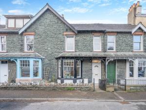 an old brick house with a green door at 3 Bed in Keswick 89526 in Keswick