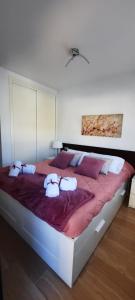 a bedroom with a large bed with pillows on it at Apartamento Marina en Moraira in Moraira
