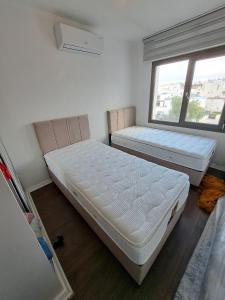 Postel nebo postele na pokoji v ubytování Erdalın evii