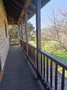 a porch on a house with a view of the water at CASA DA RIBEIRA in Quiroga