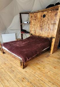 a bedroom with a bed in a tent at Gudauri Glamping in Gudauri