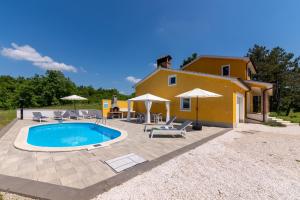 a villa with a swimming pool in front of a house at Villa Kristina by Briskva in Pazin +35 photos