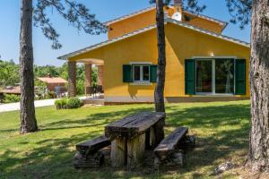 a house with a bench in front of it at Villa Kristina by Briskva in Pazin