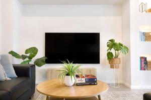 A television and/or entertainment centre at 'Infinity's Edge' Darwin Luxury Waterfront Oasis