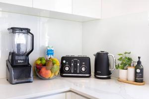 A kitchen or kitchenette at 'Infinity's Edge' Darwin Luxury Waterfront Oasis