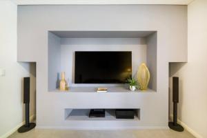 A television and/or entertainment centre at 'Infinity's Edge' Darwin Luxury Waterfront Oasis
