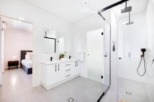 A bathroom at 'Infinity's Edge' Darwin Luxury Waterfront Oasis