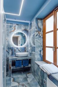 a bathroom with a sink and a mirror at Luxury For Groups & Families in city center in Turin +95 photos