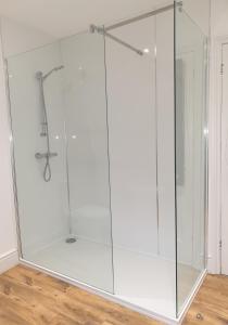 a glass shower enclosure in a room at Mulberry House Excellent central location Courtyard garden 3 Bedrooms sleeps up to 6 Parking in Exeter