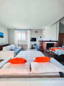 a large bedroom with two beds and a living room at Vista Sibillini - Villa Amici in Verri