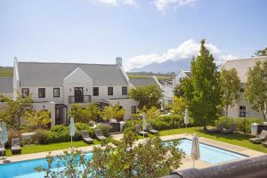 an aerial view of a house and a swimming pool at Winelands Golf Lodges 21 in Stellenbosch