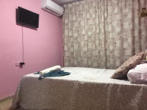 Voodi või voodid majutusasutuse RMN Tourist Home 3H toas