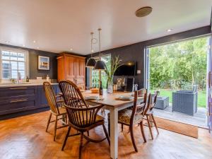 a kitchen and dining room with a table and chairs at 3 Bed in Faversham 78880 in Faversham
