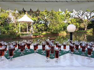 a group of wine glasses sitting on top of a table at Tarentilos in Tzaneen