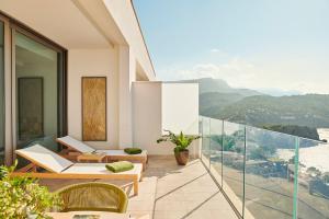 a balcony with a view of the mountains at Jumeirah Port Soller Hotel & Spa in Port de Soller