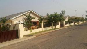 a row of houses on the side of a street at Violettes Villa in Accra