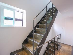 a staircase in a house with a window at Starhostel Dongdaemun Suite in Seoul