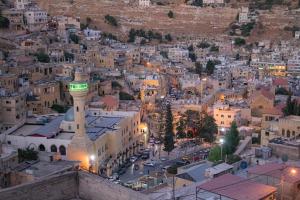 an aerial view of a city at night at Saraya locanda in Al Salt