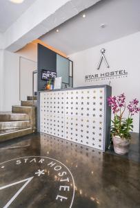 a star room with stairs and a reception desk at Starhostel Dongdaemun Suite in Seoul
