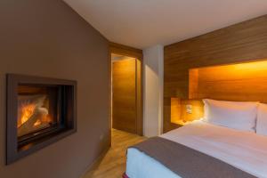 Postel nebo postele na pokoji v ubytování Chalet Eden Eco Hotel, Restaurant & Wellness