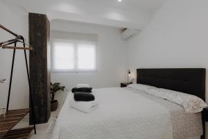 Giường trong phòng chung tại Excapada suite de Murcia