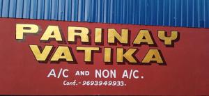 a sign for a parmasy vaikka on a container at Parinay Vatika Inn in Deoghar