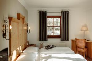 Postel nebo postele na pokoji v ubytování Hotel Lerch
