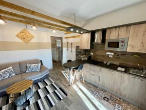 a living room with a couch and a table at Armoni in Rota d'Imagna