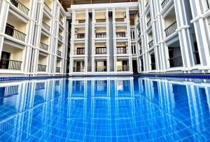 a swimming pool in the middle of a building at Casa Eternal Resort Mandrem in Mandrem