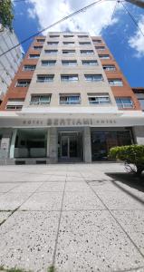 a building with the entrance to a building at Hotel Bertiami in Mar del Plata