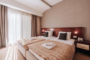 Voodi või voodid majutusasutuse Apartments Del Mar toas