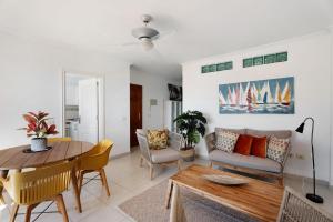a living room with a couch and a table at Ático Bellavista Alcalá A in Guía de Isora