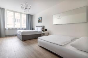 Postel nebo postele na pokoji v ubytování Prague Serenity Suites and Apartments