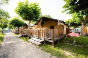 a house with a porch and stairs to it at Glamping Bretagne in Quimper