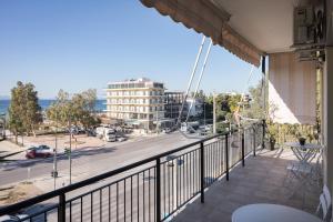 a balcony with a view of a street at Glyfada Cozy Living in Athens