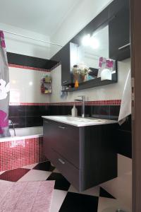 a bathroom with a sink and a mirror at Cozy family home in Katouna in Katouna +19 photos