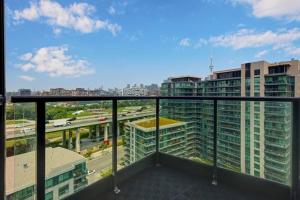 a balcony with a view of a city at 2 BR Waterfront Condo Downtown w/ free Parking in Toronto