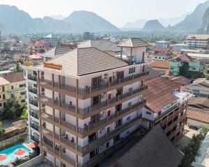 an overhead view of a building with mountains in the background at Vangvieng Sisavang Mountain View Hotel in Vang Vieng