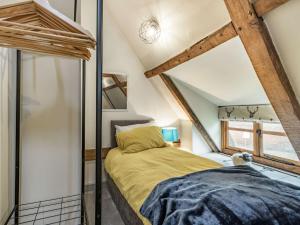 a bedroom with a bed in a attic at 3 Bed in Wroxham 86387 in Swanton Abbot