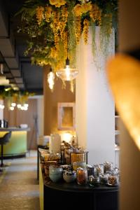 a buffet of food on a table in a room at happYellow Boutique House in Saalbach-Hinterglemm