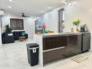 a kitchen with a counter and a trash can at Ocean Pearl - Getaway Holiday home in Long Bay Hills