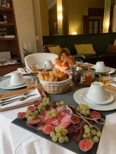 a table with plates of food on a table at La Demeure des Sacres in Reims