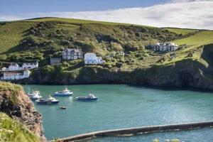 a group of boats in a large body of water at The Cornish Nook by StayStaycations in Camelford