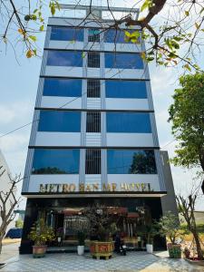 a building with a sign that reads nirvana human hotel at Khách Sạn Metro Ban Mê in Buon Ma Thuot