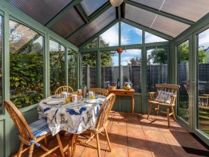 a conservatory with a table and chairs on a patio at 2 bed in Bognor Regis 79283 in Bognor Regis