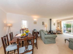 a dining room and living room with a table and chairs at 2 bed in Bognor Regis 79283 in Bognor Regis