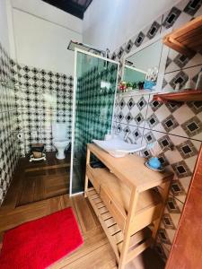 a bathroom with a sink and a shower at Casa com Piscina in Canavieiras