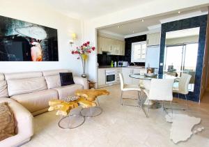 a living room with a couch and a table at CostaBlancaDreams Capri in Calpe in Calpe