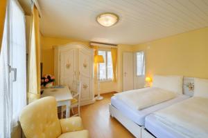 Ein Bett oder Betten in einem Zimmer der Unterkunft Seehof Hotel Du Lac