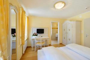 Ein Bett oder Betten in einem Zimmer der Unterkunft Seehof Hotel Du Lac